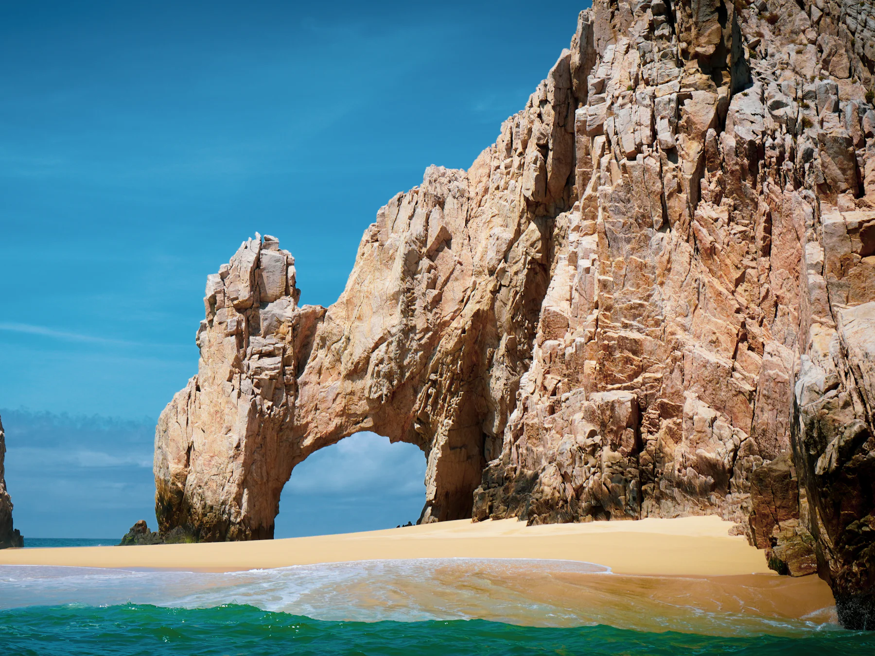 El Arco and the sandy beach at Land’s End, Cabo San Lucas, seen from the water